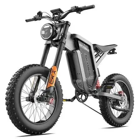 Black electric mountain bike front 3/4 view, headlight, fat tires, disc brakes, orange accents.