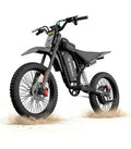 Black electric mountain bike with fat tires, full suspension, and disc brakes.