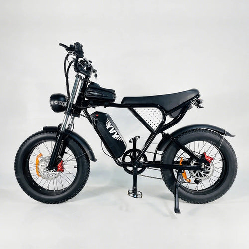 Black electric fat-tire bike with mounted battery, front fork suspension, disc brakes