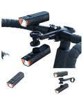 Black front bike headlight with handlebar clamp and mounting accessories shown