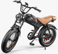 Black all-terrain e-bike angled side view with fat tires and seat